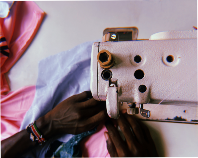 An upcycled shirt being stitched on a sewing machine